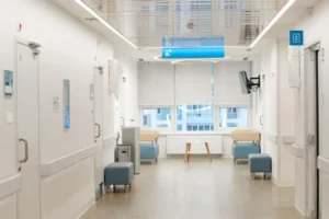Universal hospital wayfinding signs with ADA-compliant directional signage in a modern medical facility